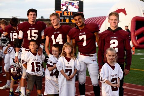 From left to right: Tyler Chavez, Kade Goertzen, De'Riece Burse, and Dawsen Counts, standing with their littles.