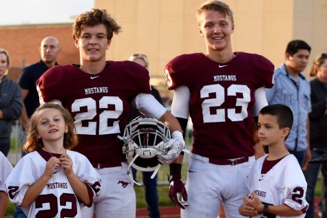 Jordan McMullen and Dylan Wentzel with their littles pregame.