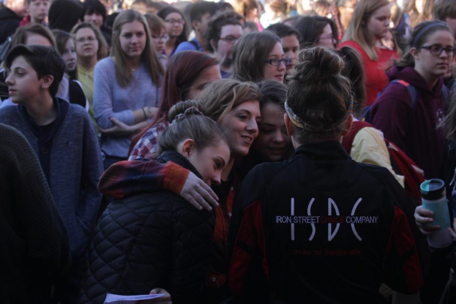 A+group+of+students+hug+during+the+speeches+and+walkout+on+March+14.