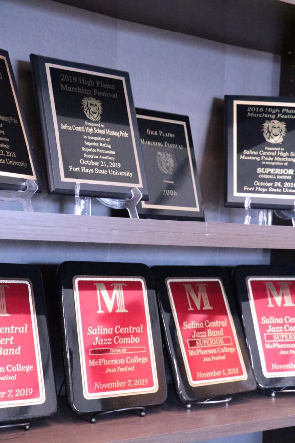 Several awards line a shelf in the band and orchestra room, all earned under the direction of Rohrer.