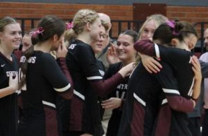 Senior Remi Myers (right) hugs junior Mckynlee Dunlap at Oct. 15 senior night. "I've gotten close with this grade," Dunlap said, "and it didn't really hit me until they were announcing their names."