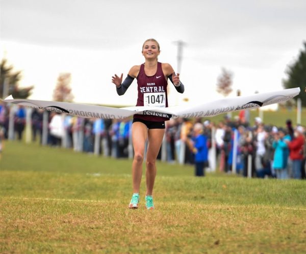 Katelyn Rupe cross the finish line in first place at the 5A girls state cross country meet.