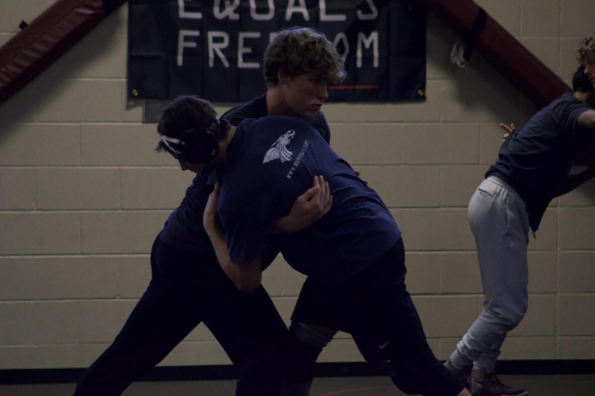 Cooper Reves and Abram Owings wrestle at practice