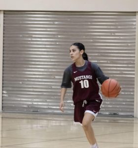 Lexie Guerrero dribbles the ball up the court