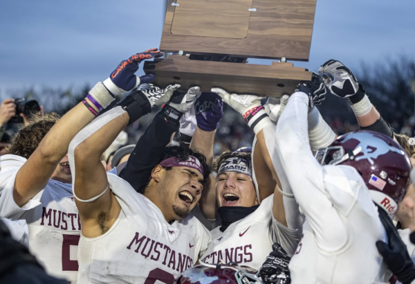 Jesus Delgado (left) and Abram Owings celebrate state championship victory