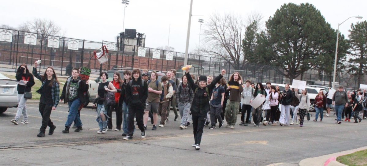 Central students walk out of Central parking lot towards Crawford St. for ICE protest on March 4. 
